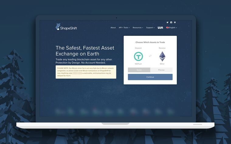 The ShapeShift site on a laptop: one screen to choose which assets to trade, Tether into Ethereum.